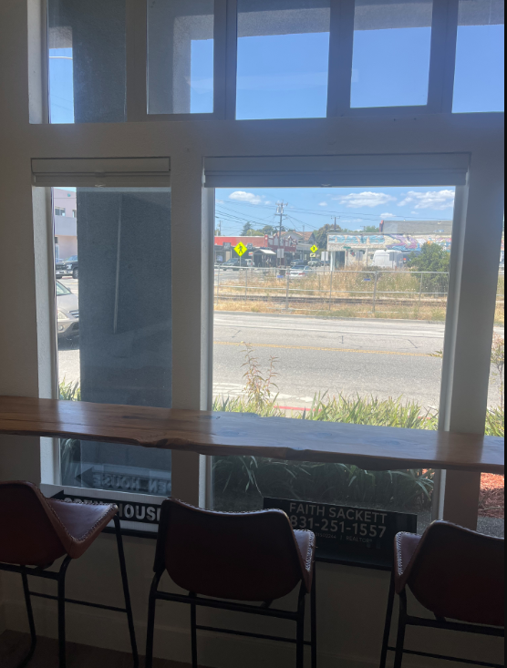 On The Bay office — live-edge window bar with seating